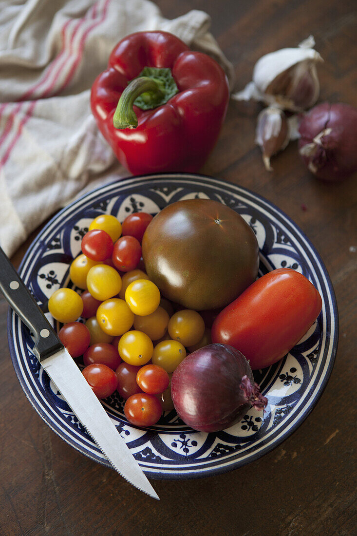 High angle view of vegetables and knife on plate