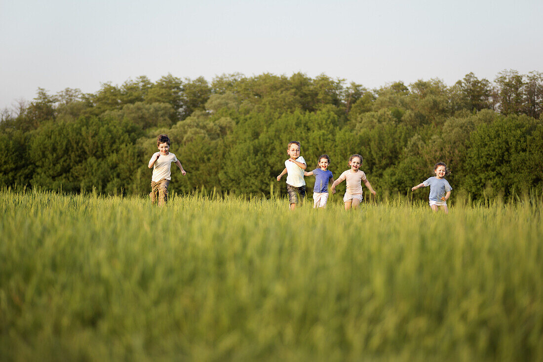 Children running in a field