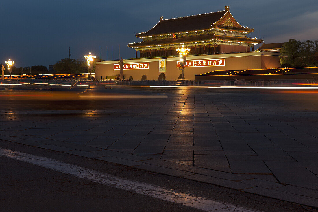 Moving traffic at the Gate of heavenly peace in Tiananmen Square, Beijing, China