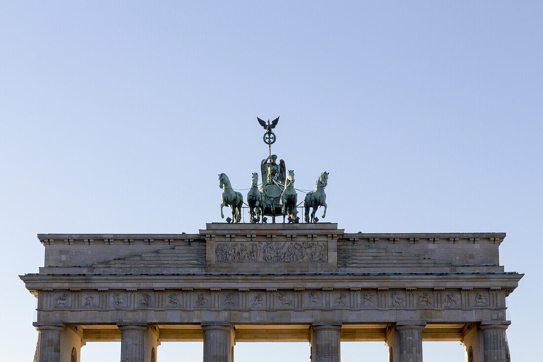 High section of Brandenburg Gate against clear sky, Berlin, Germany