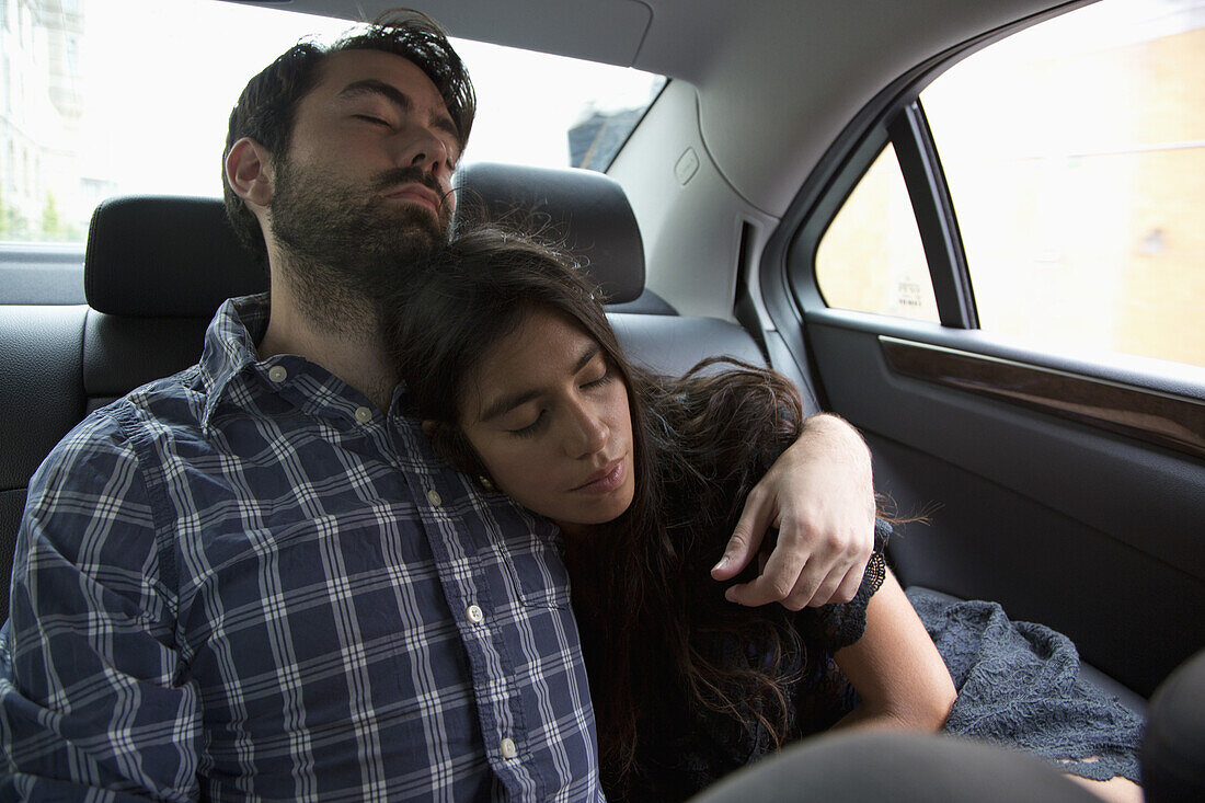 Young couple relaxing in car