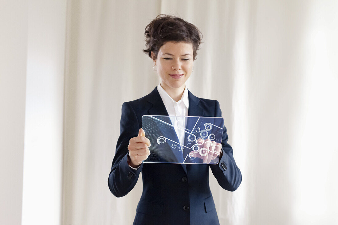 Confident Businesswoman Using Futuristic Digital Tablet