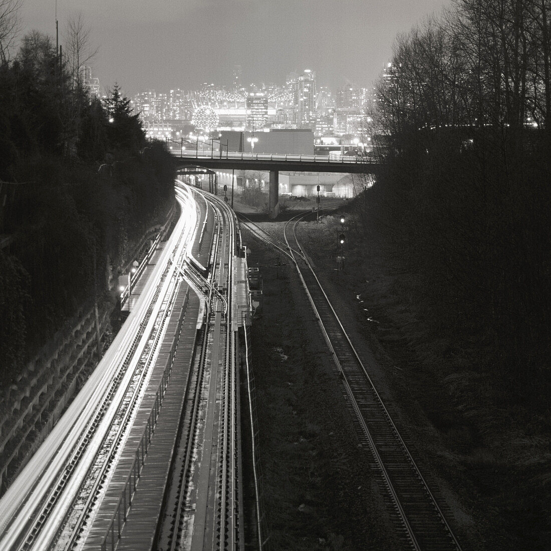 Railway tracks leading to city skyline of Vancouver, British Columbia, Canada