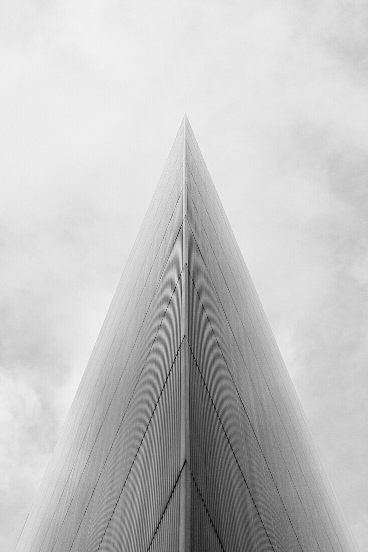 Low angle view of modern glass building against sky