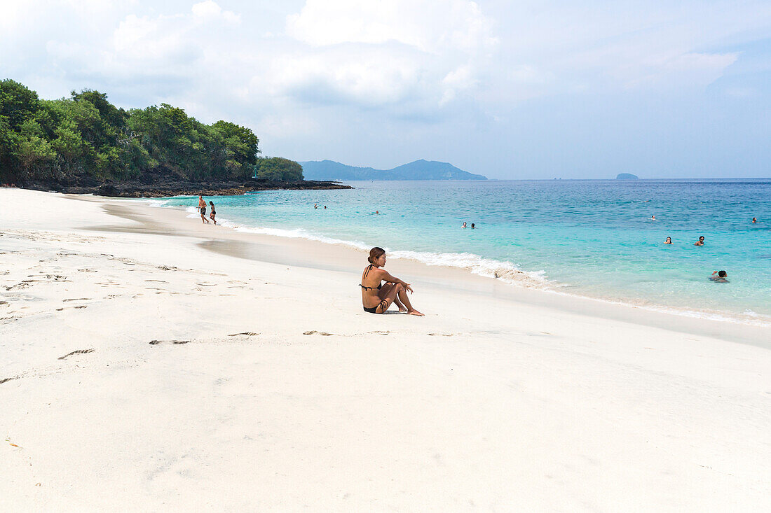 Woman at the white sand beach, Padangbai, Bali, Indonesia