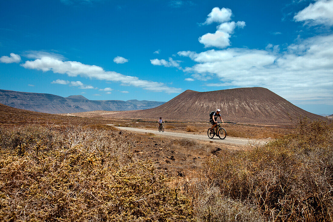 Cyclist on the island of La Graciosa, Lanzarote, Canary Islands, Spain