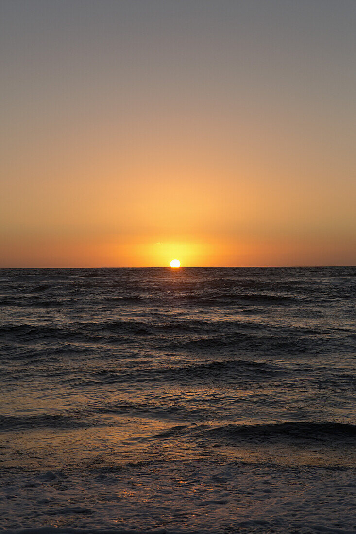 Sun setting on the sea