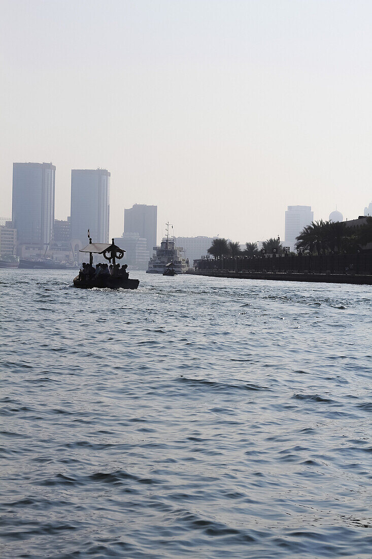 People on water taxi along Dubai creek, Dubai, United Arab Emirates