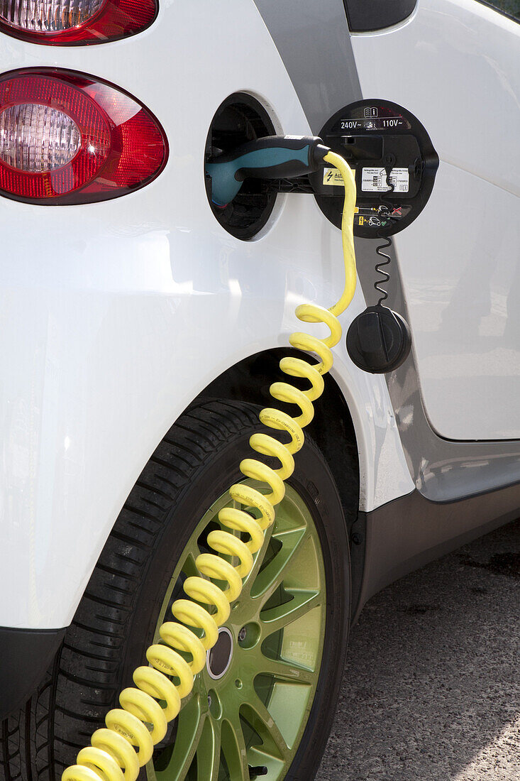 Detail of a charger connected to an electric car recharging