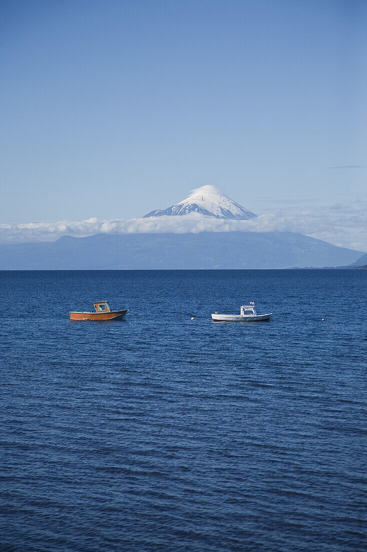 View of boats on Lake Llanquihue and Osorno Volcano, Puerto Varas, Chile