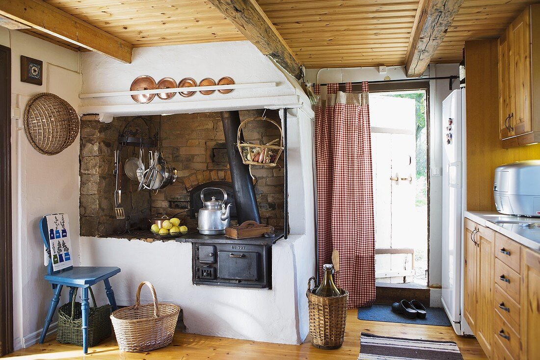 An old kitchen oven with a fireplace extraction hood in a country weekend house
