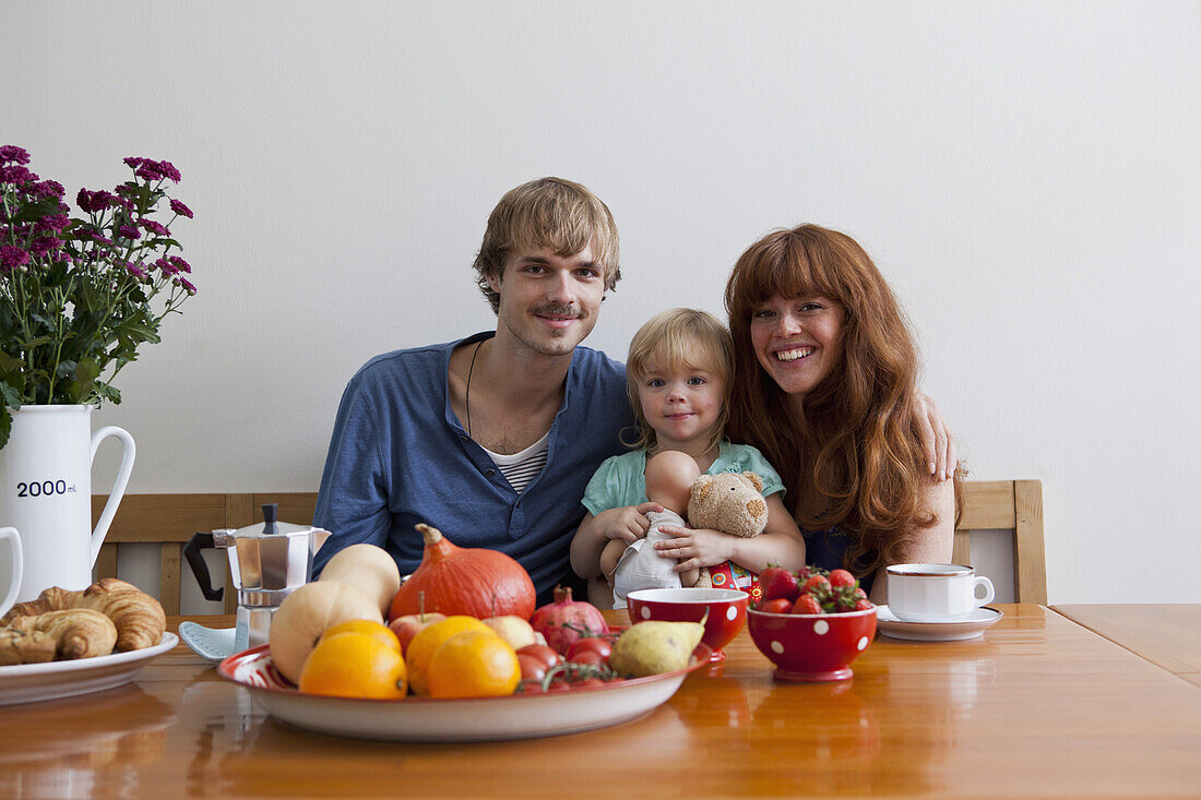 A young family having breakfast