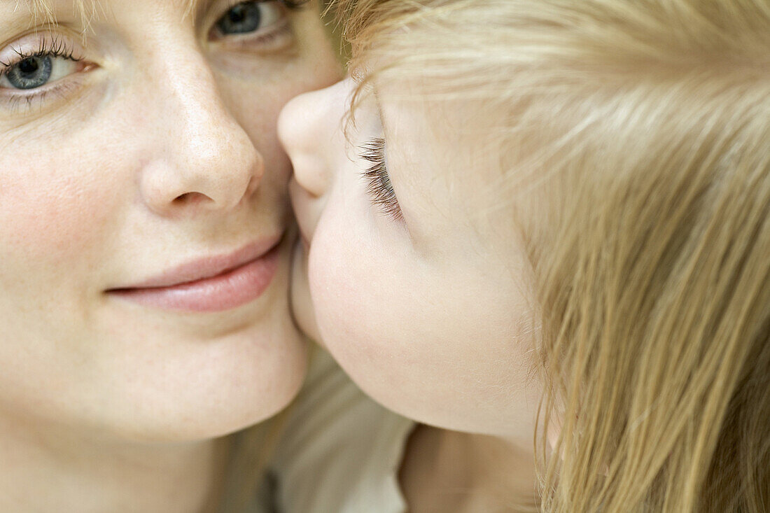 An affectionate mother and daughter, close-up