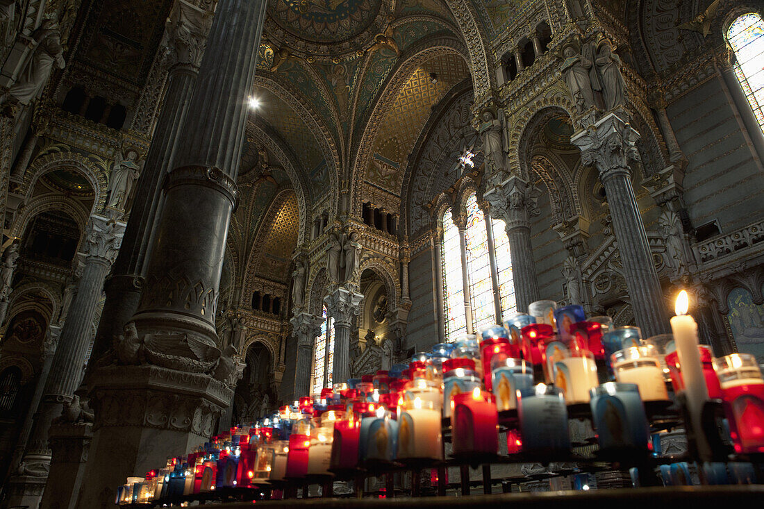 Lit votive candles in the Basilica Notre Dame De Fourviere, Lyon France