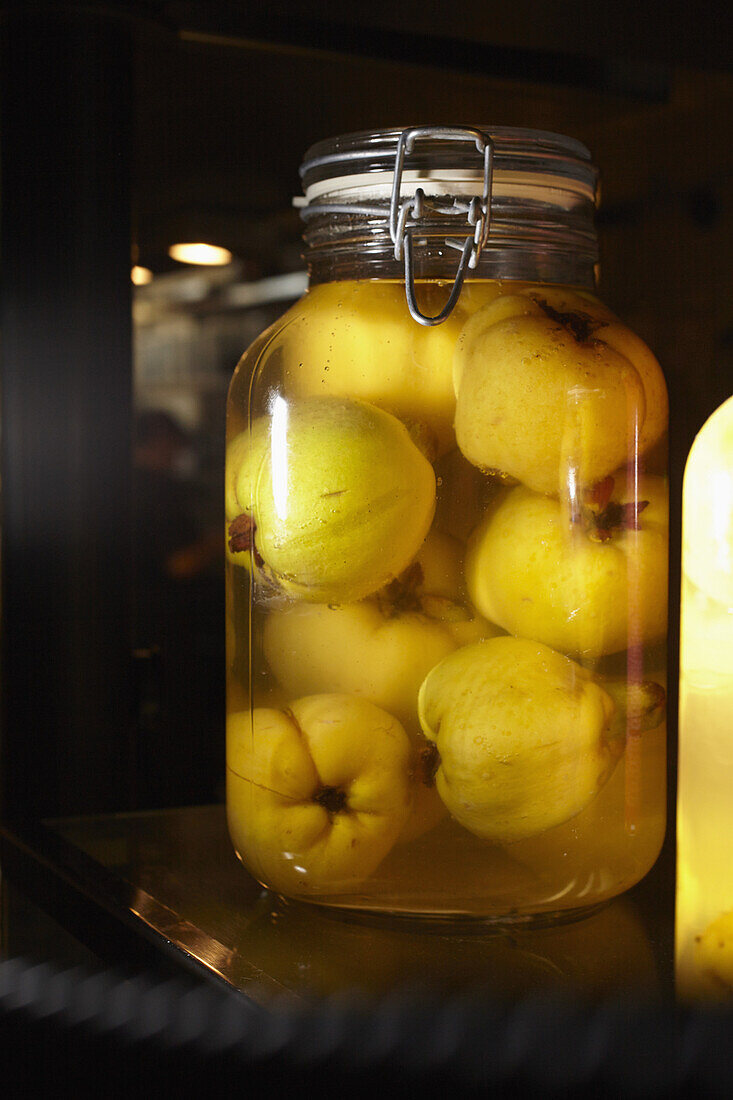 Quinces in glass jar