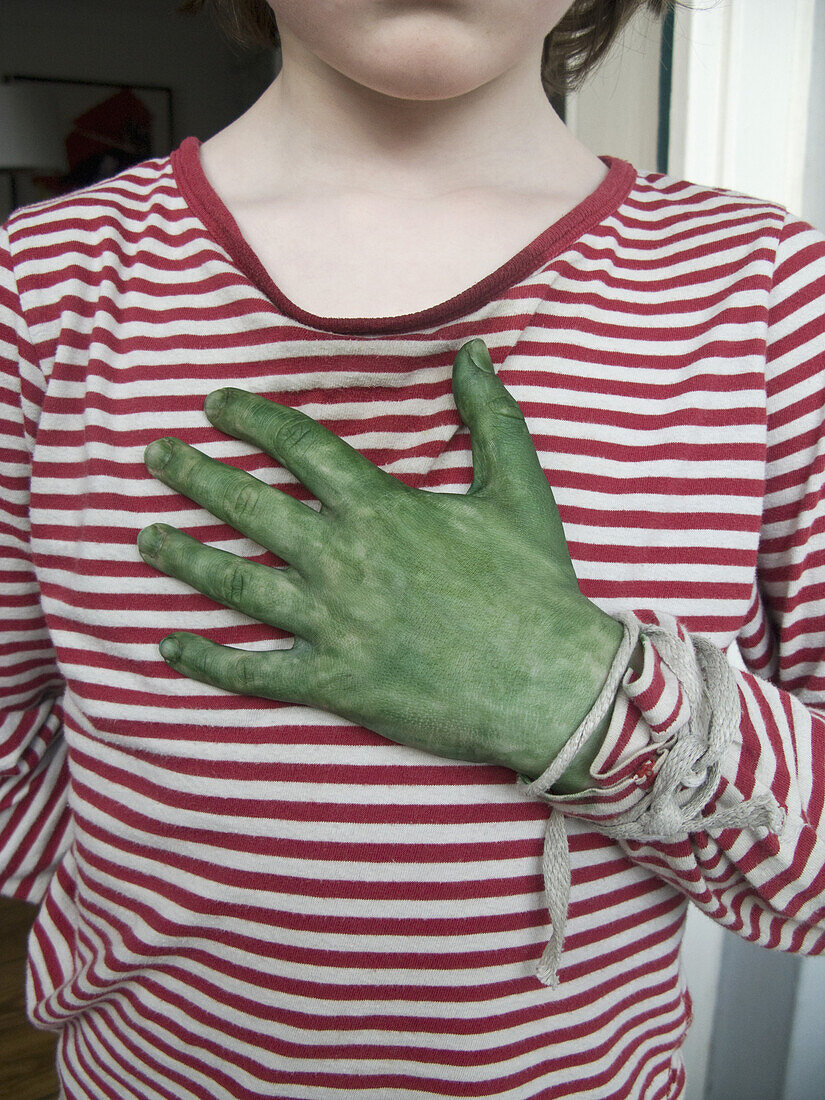 A boy dressing up for Halloween