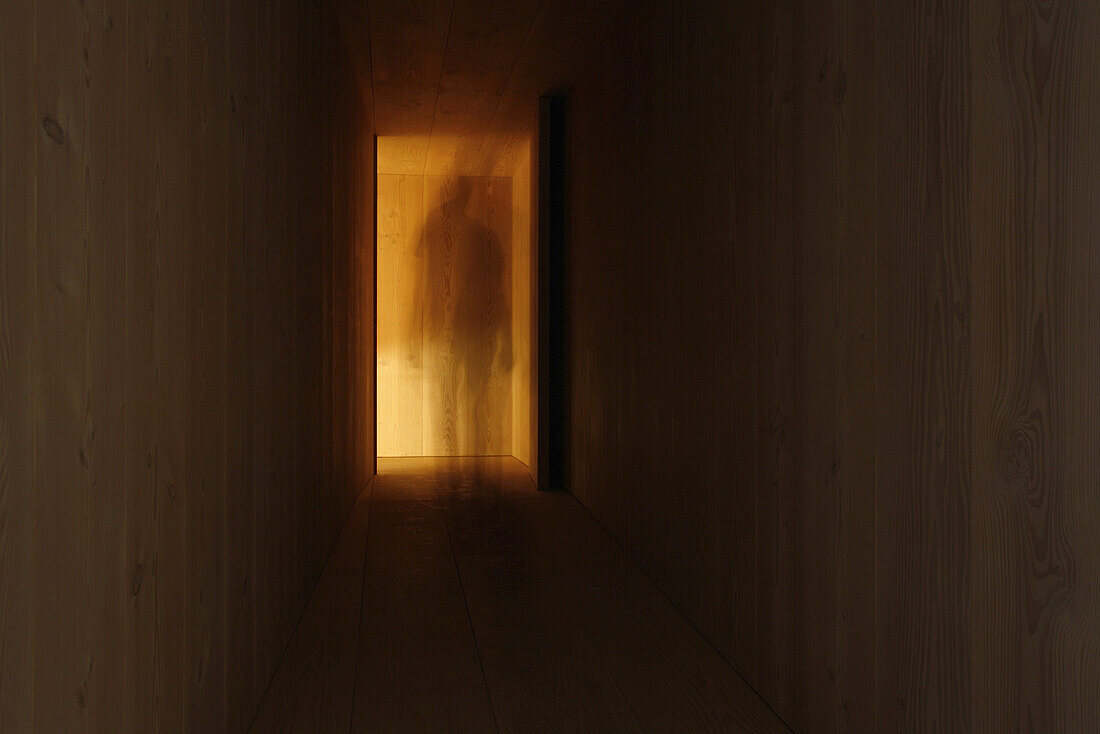 A person walking through a corridor, blurred motion