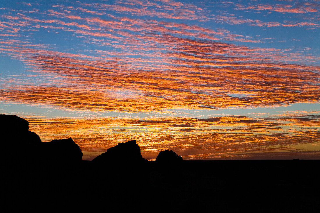Sunset in stony desert, Black Desert, Akakus mountains, Libya, Sahara, North Africa