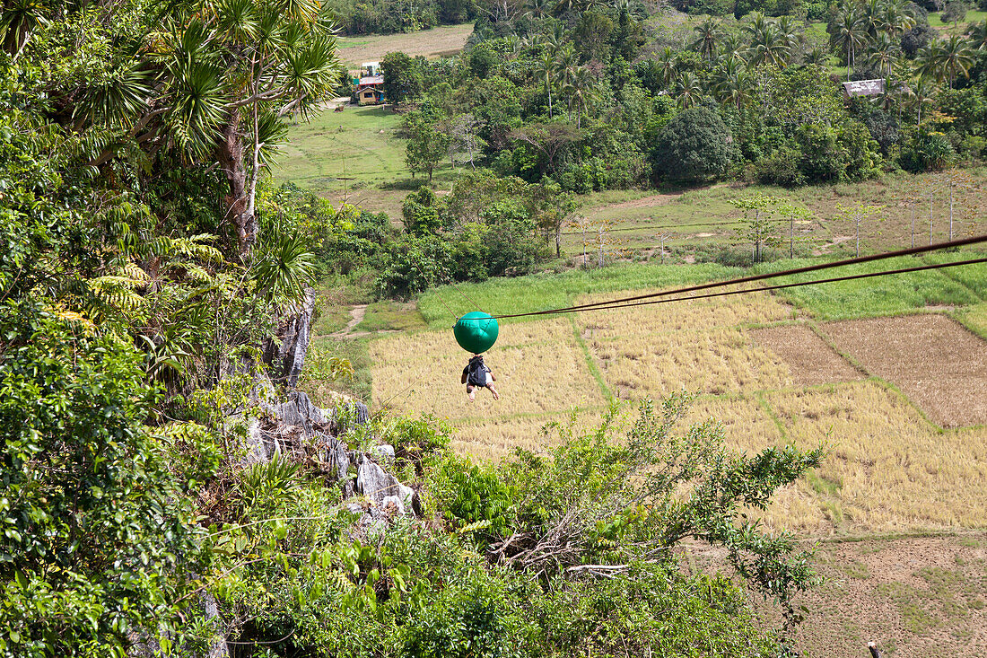 Zipline gliding on the west coast of Palawan Island, Philippines, Asia