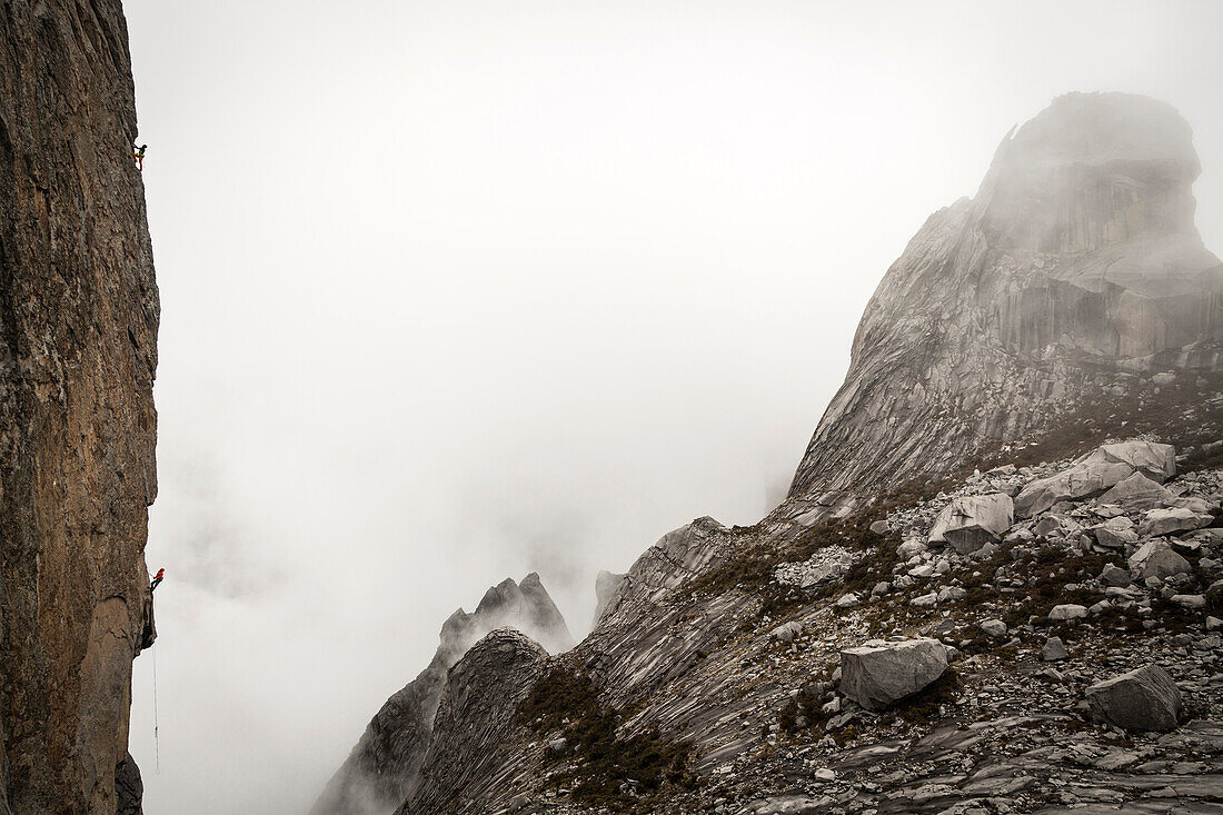 Stefan Glowacz and Nina Schlesener climbing on Ugly Sister Peak 4032 m, Mount Kinabalu, Borneo, Malaysia.