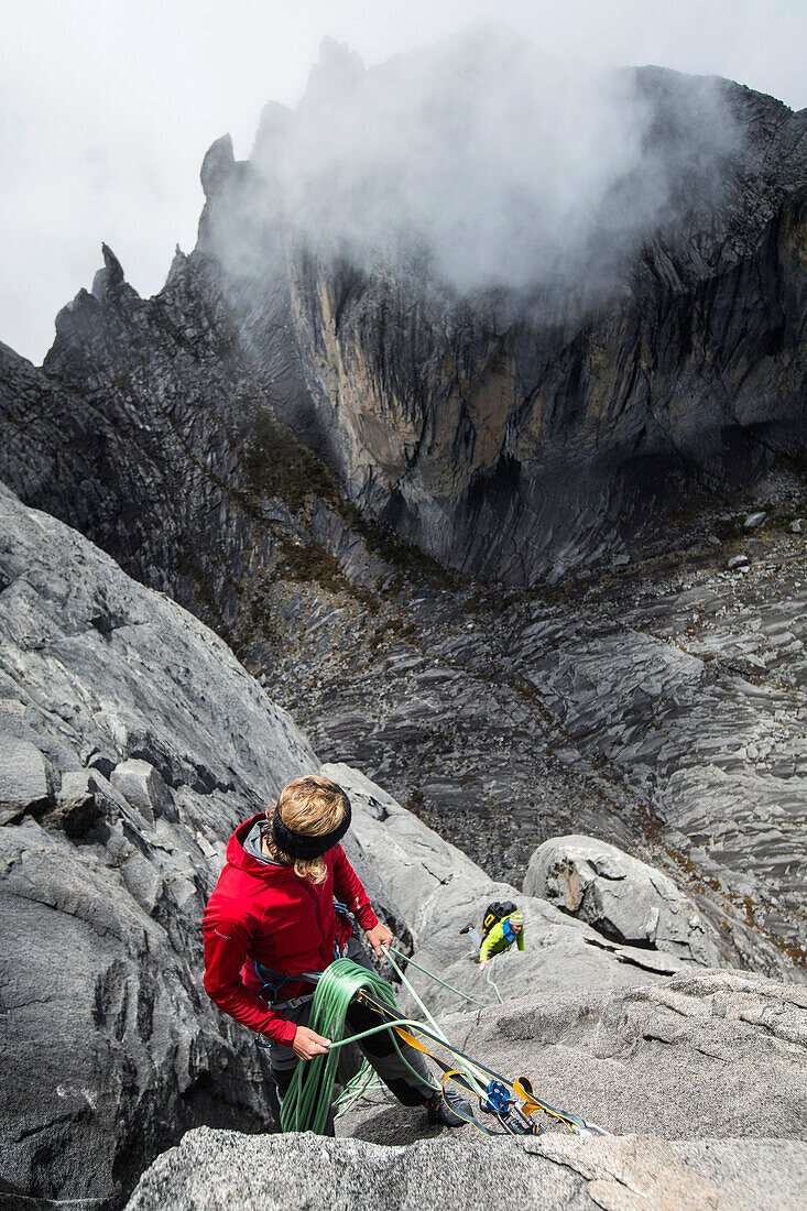 Christian and Nina Schlesener climbing the last 3 pitch of the new climbing route on Victoria Peak, Mount Kinabalu, Borneo, Malaysia.