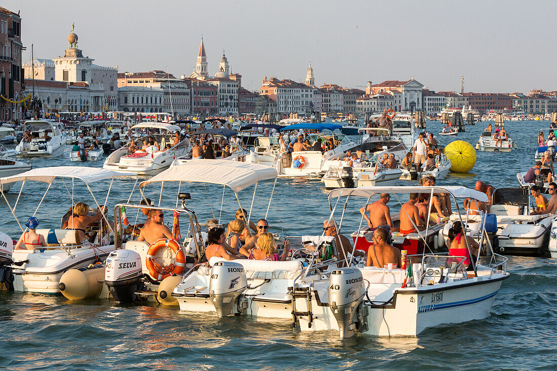 Festa del Redentore, Redentore Feast Day, thanks that the plague ended, party boats anchored, Giudecca, sunset, 3rd Sunday of July, San Marco in background, Venice, Italy