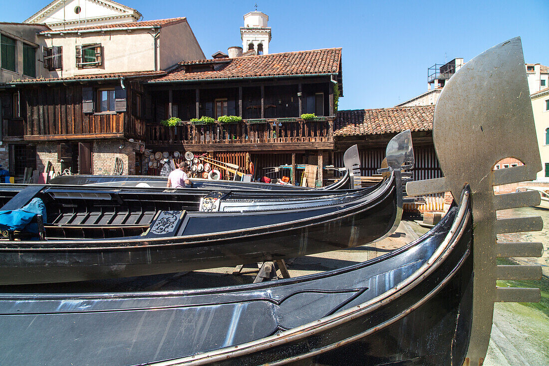 Lorenzo della Toffola, traditional gondola boat builder, dry dock, maintenance, black lacquer, decoration, Dorsoduro, Venice, Veneto, Italy