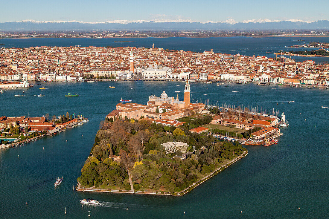 aerial shot above island of San Giorgio Maggiore, San Marco, Giudecca, Alps, Dolomites, lagoon, panorama, Venice, Italy