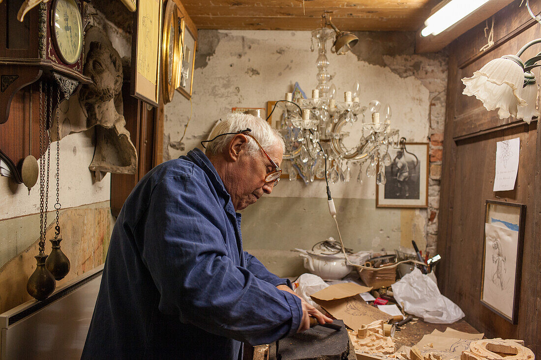woodcarver, Emilio Piacentini restores furniture, workshop, chairs, carves picture frames, timber artefacts, decoration for gondolas, Cannaregio, Venice, Italy