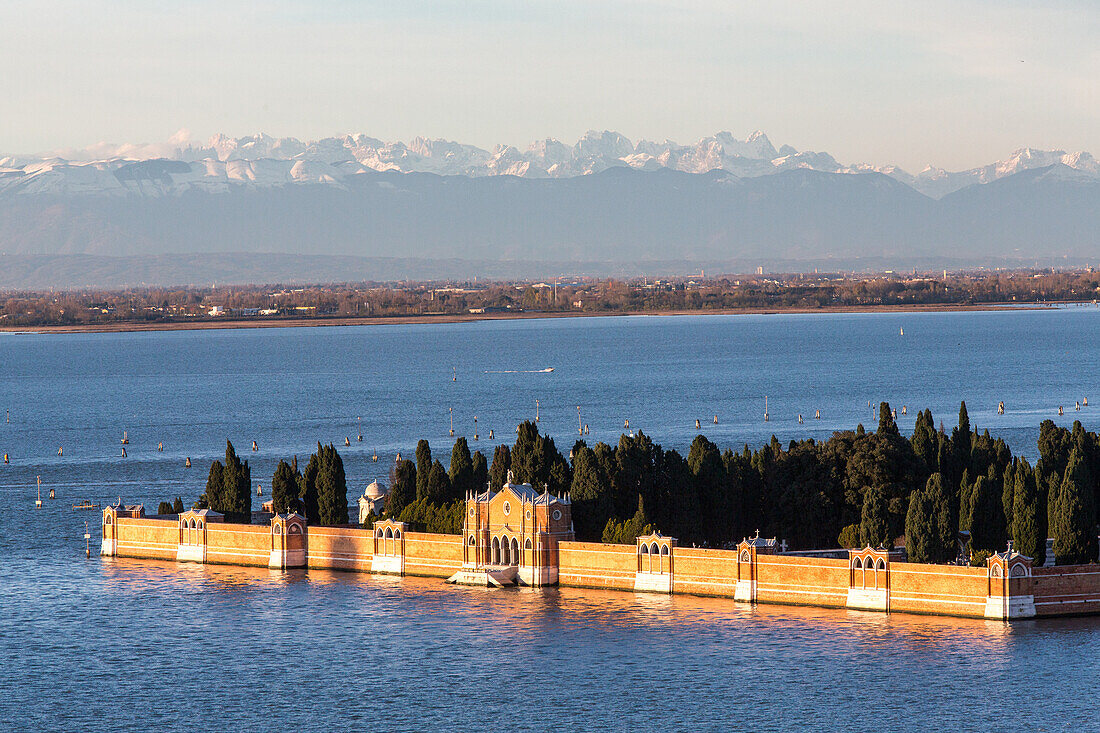 Island of San Michele, cemetery of Venice, background snow covered Alps and Dolomite mountains, Venice, Italy