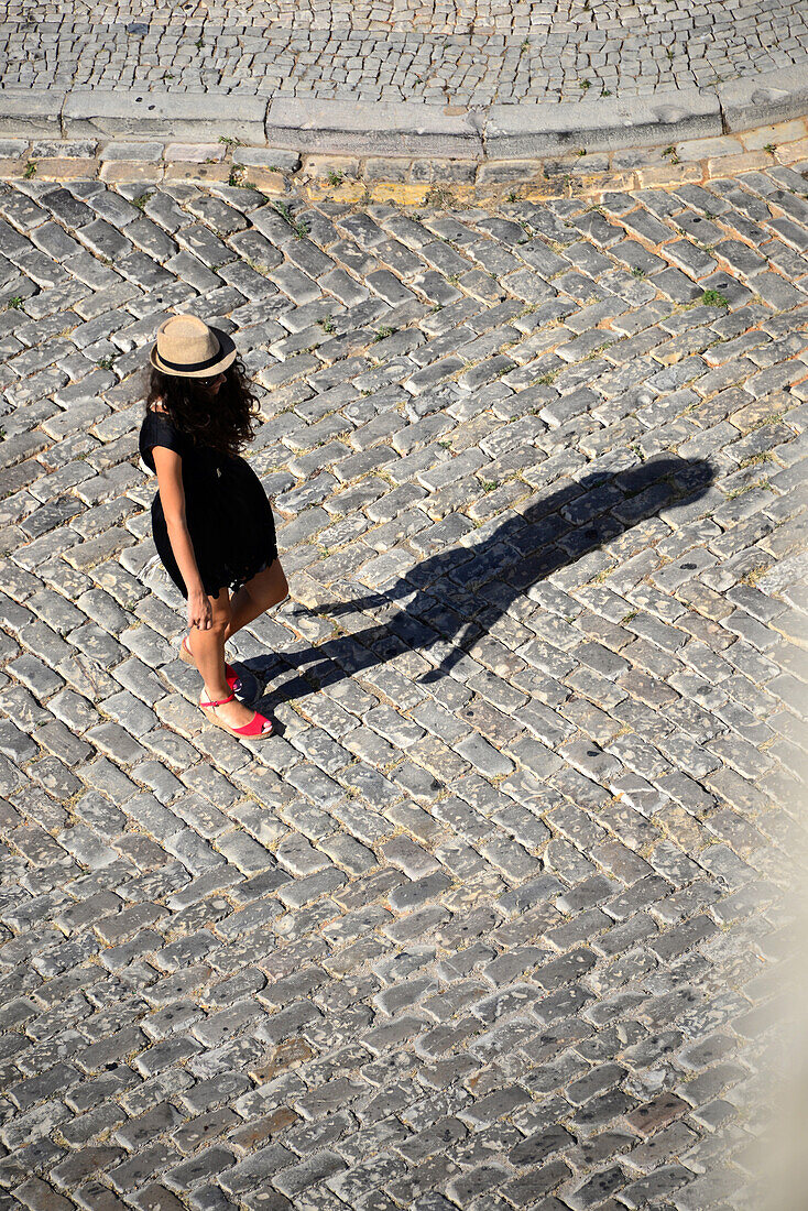 Girl seen from the cathedral tower, Faro, Algarve, Portugal
