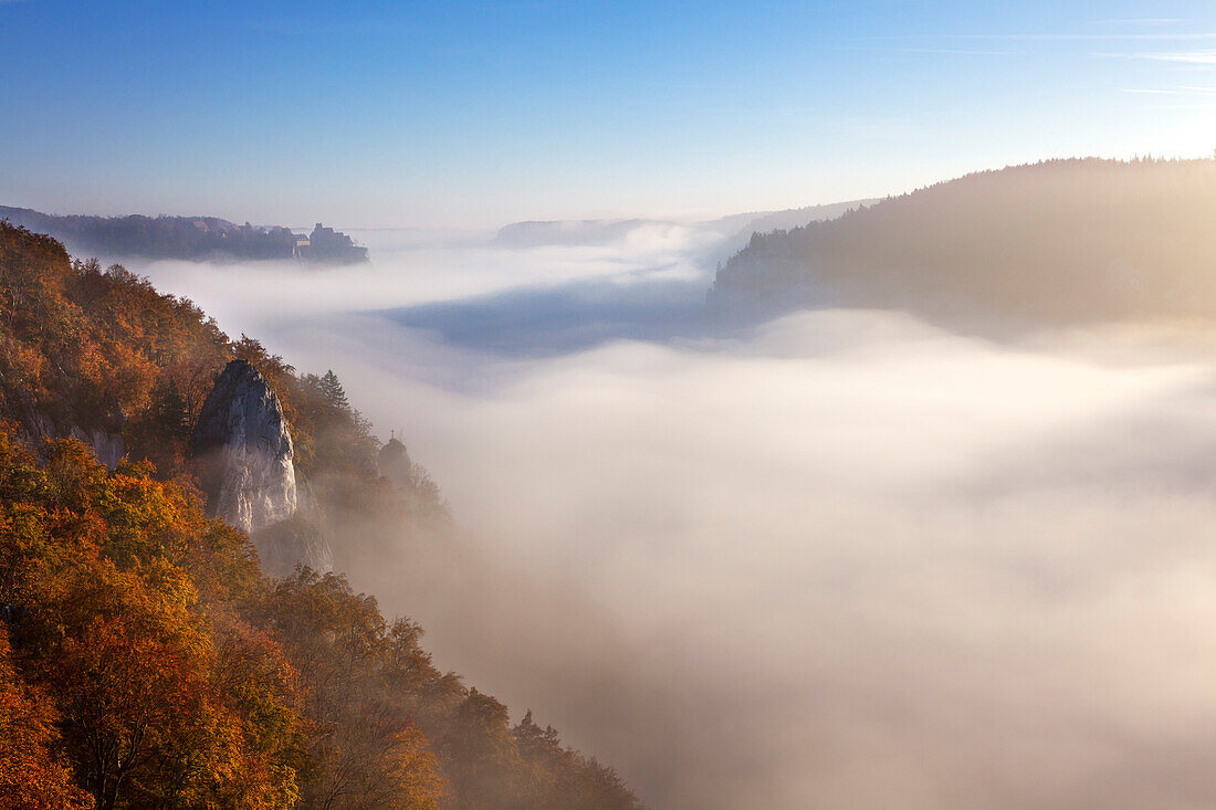 Mist in the valley of the Danube river, view to Werenwag castle, Upper Danube Nature Park, Baden- Wuerttemberg, Germany