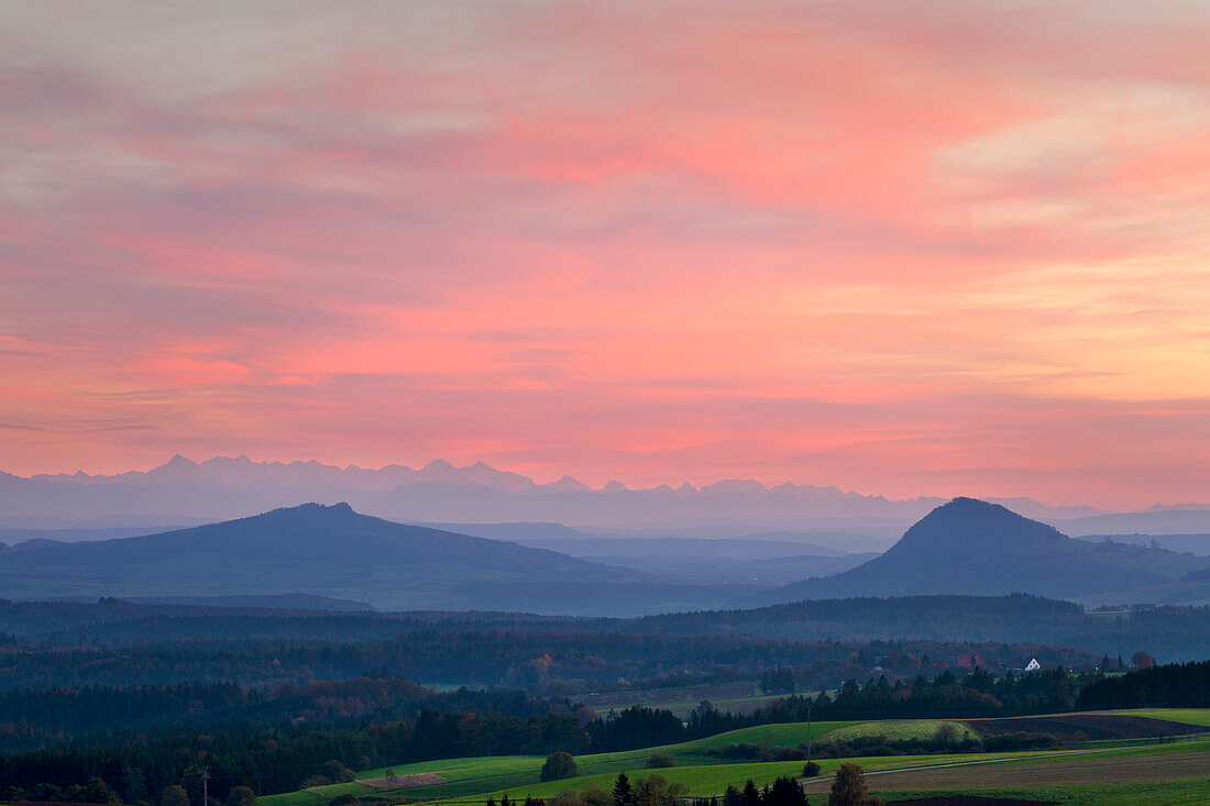 View over the volcanic mounts of the Hegau region, Hohenstoffeln and Hohenhewen, to the range of the Berner Alps, Hegau, Baden-Wuerttemberg, Germany