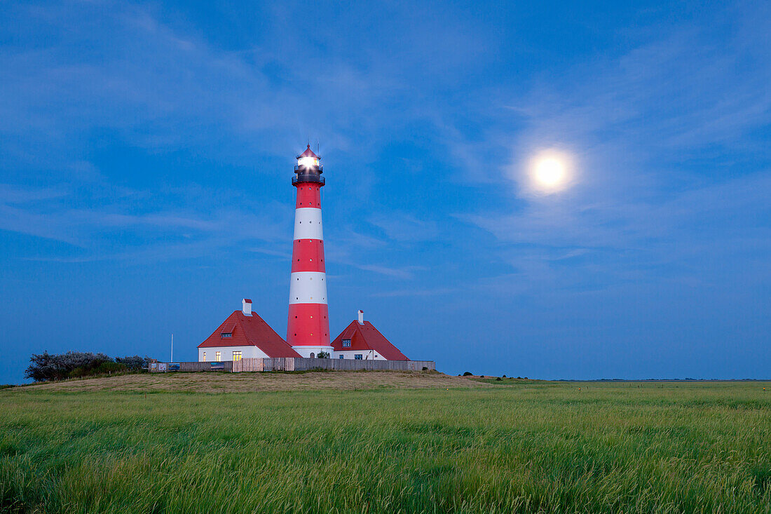 Westerhever lighthouse at full moon, Eiderstedt peninsula, Schleswig-Holstein, Germany