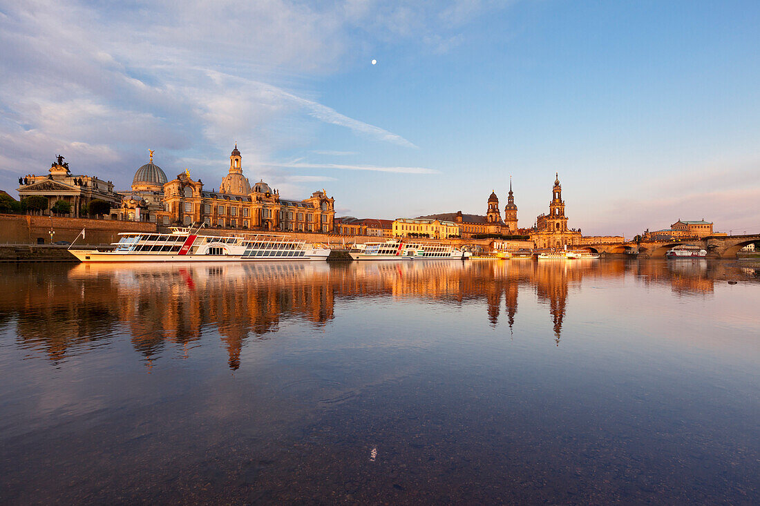 Morning mood, moon reflecting in the river Elbe, Bruehlsche Terrasse, Frauenkirche, Staendehaus, Residenzschloss, Hofkirche and Semperoper, Dresden Saxony, Germany