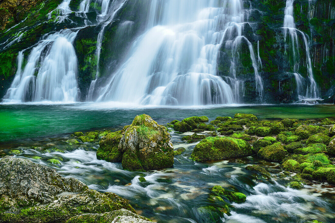 Waterfall cascading in a green pond, Gollinger Wasserfall, Golling, Berchtesgaden range, Salzburg, Austria