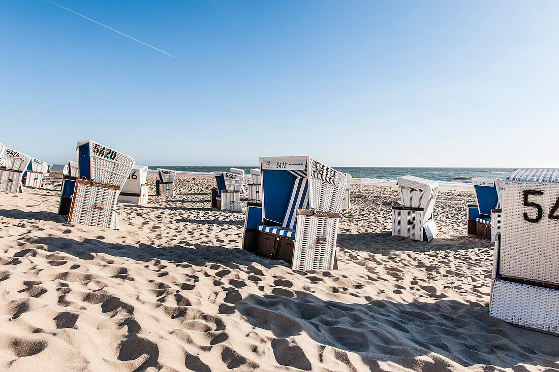 Roofed wicker beach charis at beach, Kampen, Sylt, Schleswig-Holstein, Germany