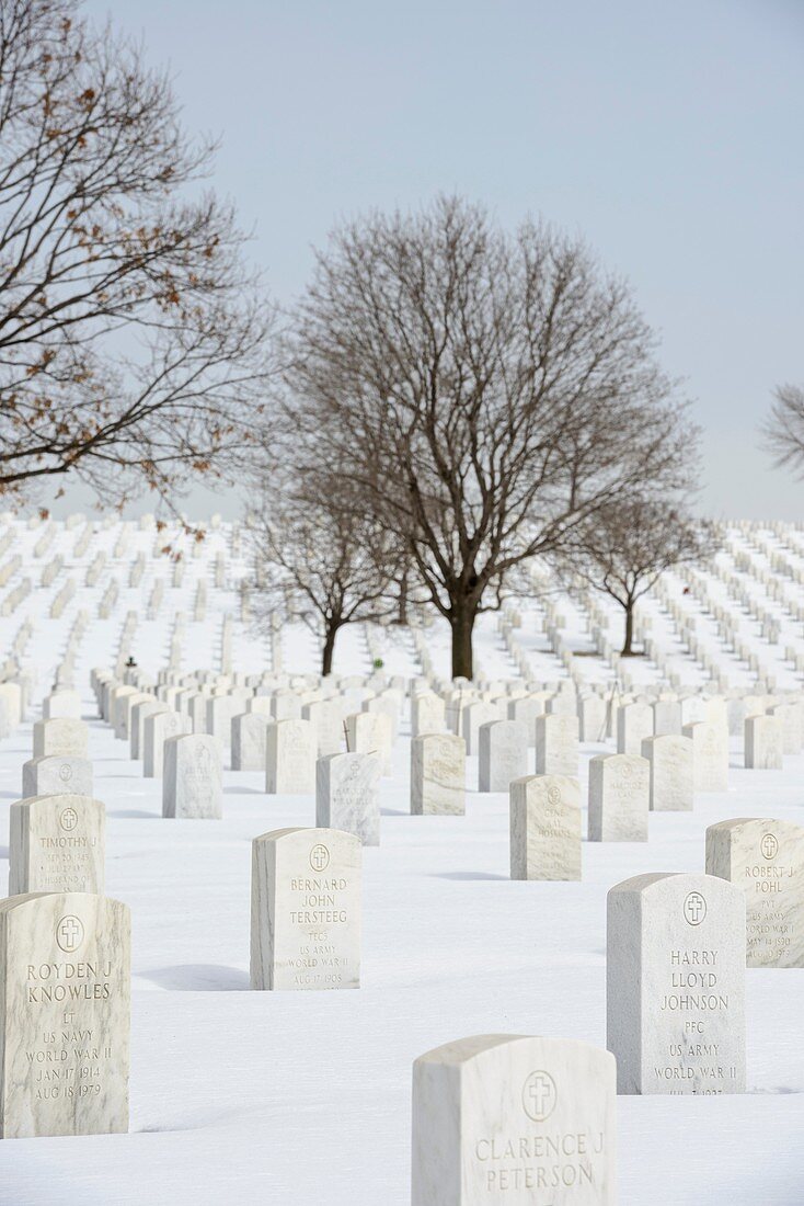 Grave markers at Fort Snelling National Cemetery during winter.