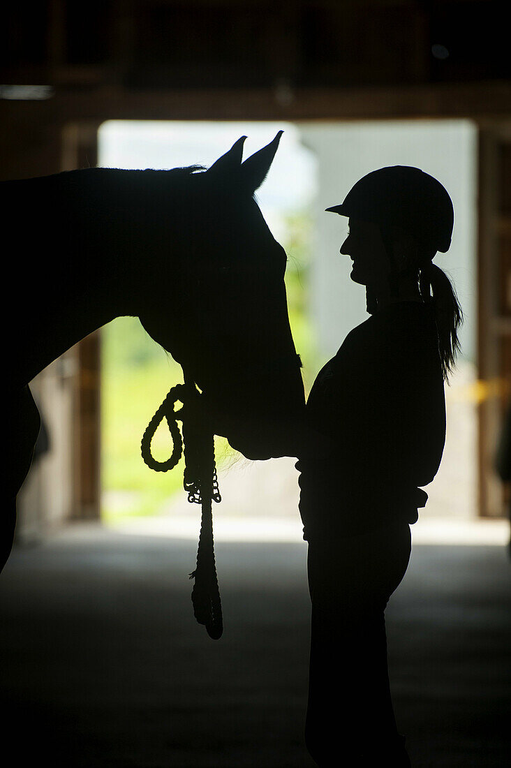 Woman and horse silhouette. Orono Maine USA