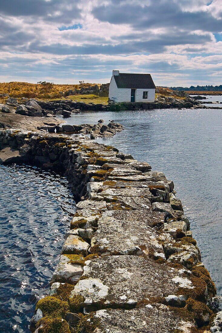 Boatkeepers office at the shore of a small lake in Connemara, near Maams Cross, County Galway, Ireland.