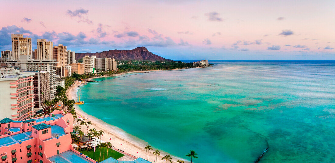 Hawaii, Oahu, Waikiki, View Of Hotels Along Ocean And Diamond Head, Evening Glow.