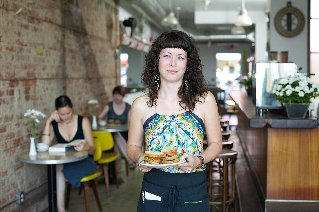 Waitress Holding Sandwich