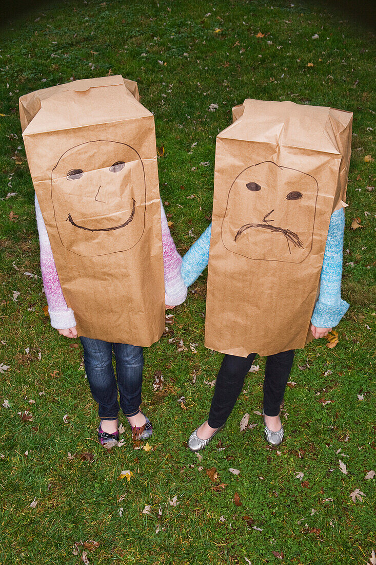 Sisters With Large Paper Bags Over Their Heads
