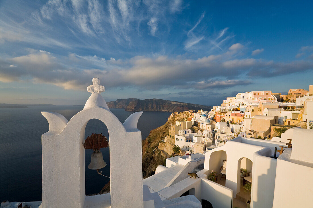 View Of The Village Of Oia Perched On Steep Cliffs Overlooking The Submerged Caldera, Santorini, Greece