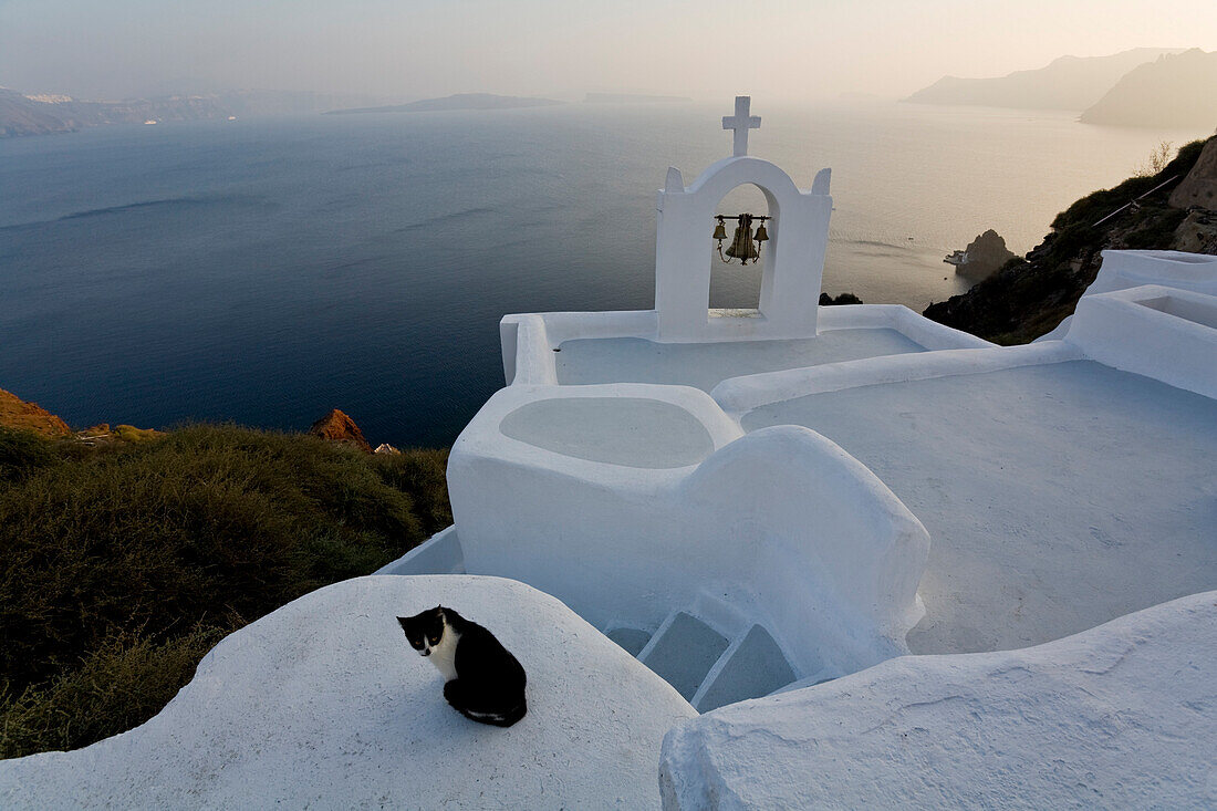 View From The Village Of Oia Perched On Steep Cliffs Overlooking The Submerged Caldera, Santorini, Greece