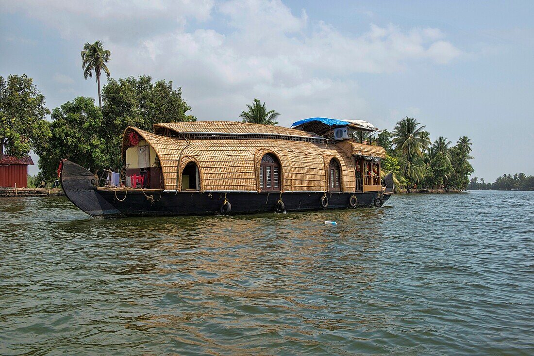 houseboat sailing on the backwaters of Kerala, India.