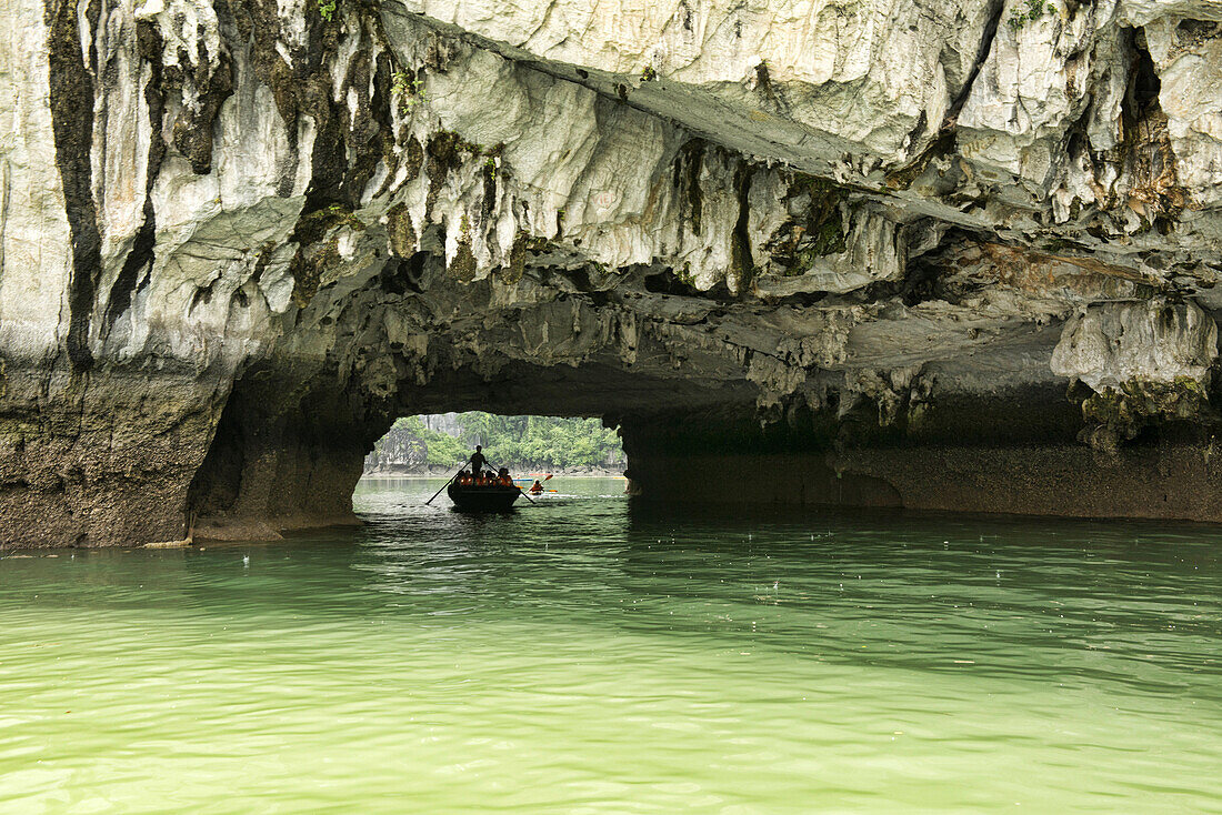 exploring a hidden lagoon by raft in Halong Bay, Vietnam.