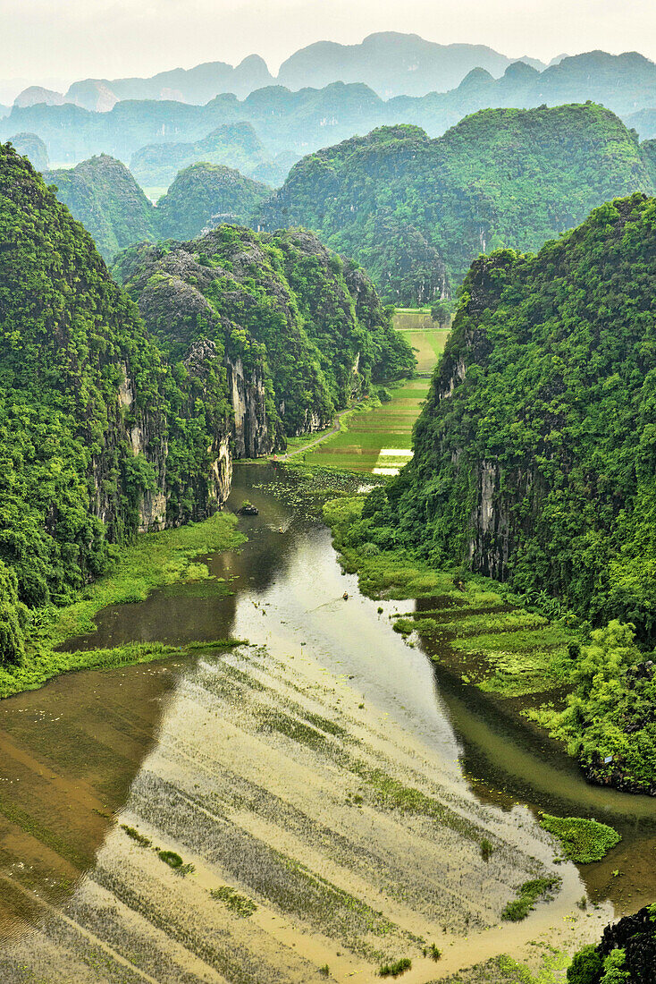 beautiful limestone karst mountains over the Tam Coc River in Ninh Binh, Vietnam.