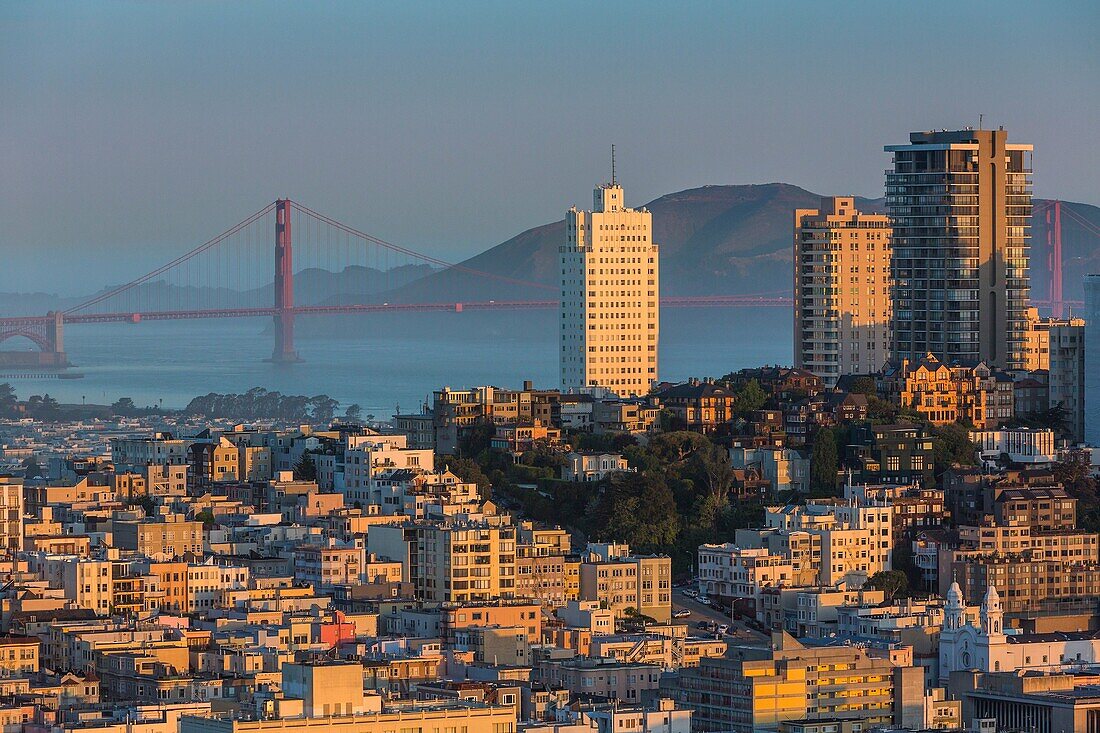 San Francisco skyline and Golden Gate Bridge at sunrise, California, USA