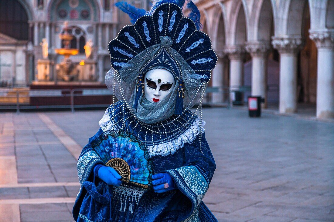 A masked woman at the carnival in Venice, Italy, Europe